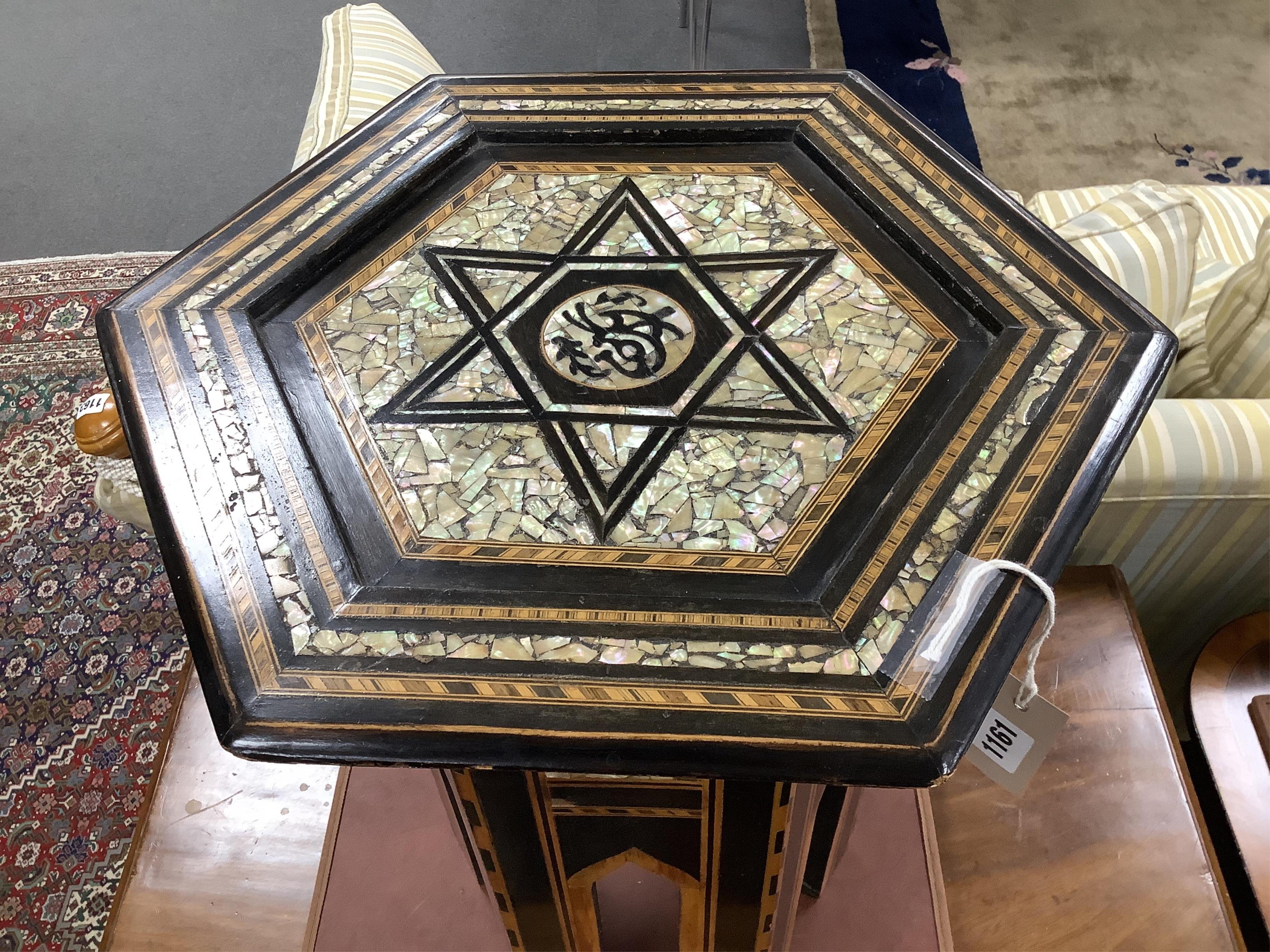 A Moorish hexagonal mother-of-pearl inlaid occasional table, width 41cm, height 51cm. Condition - good